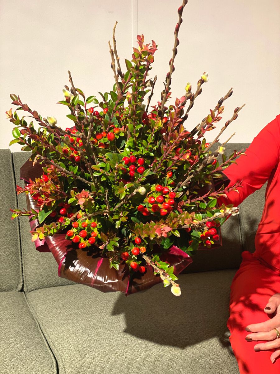 Floral arrangement using red hypericum flowers