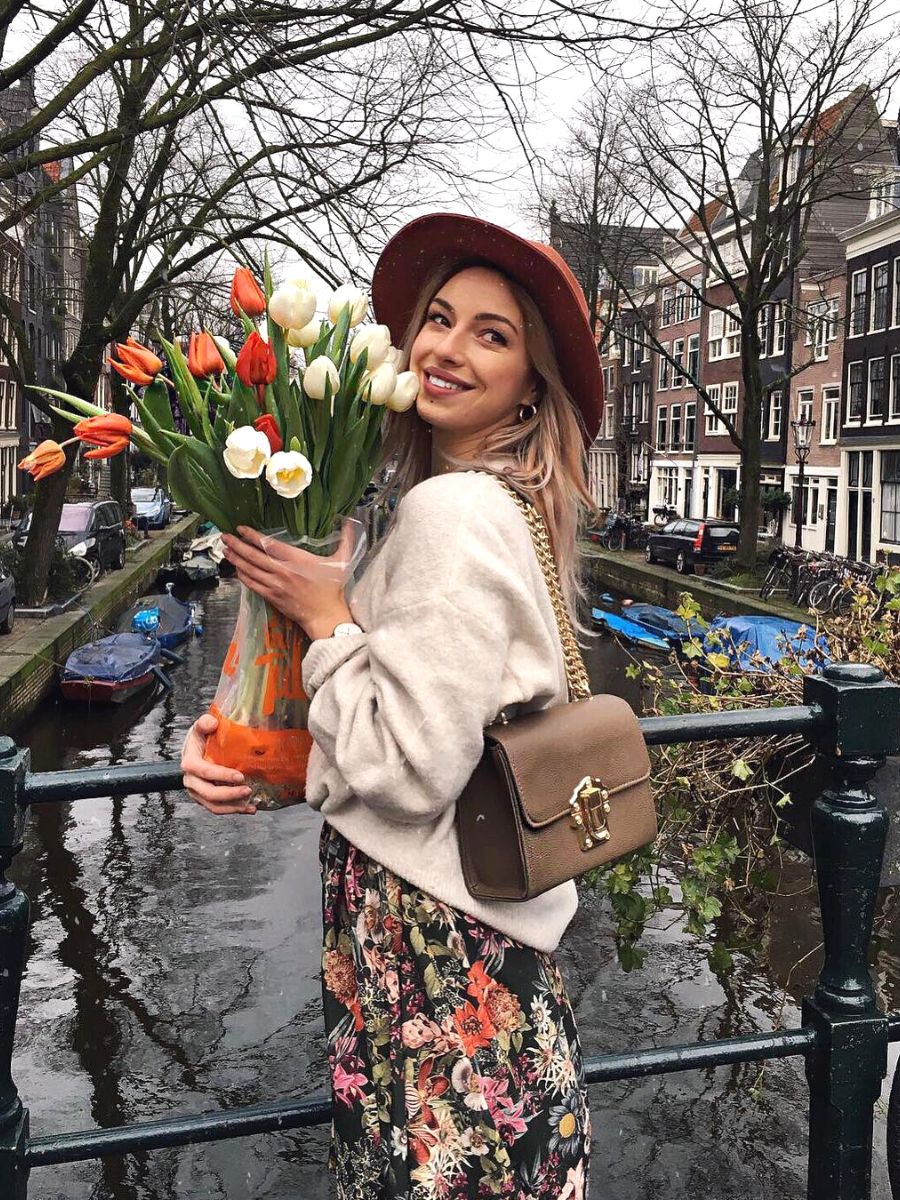Girl with tulips in an Amsterdam canal