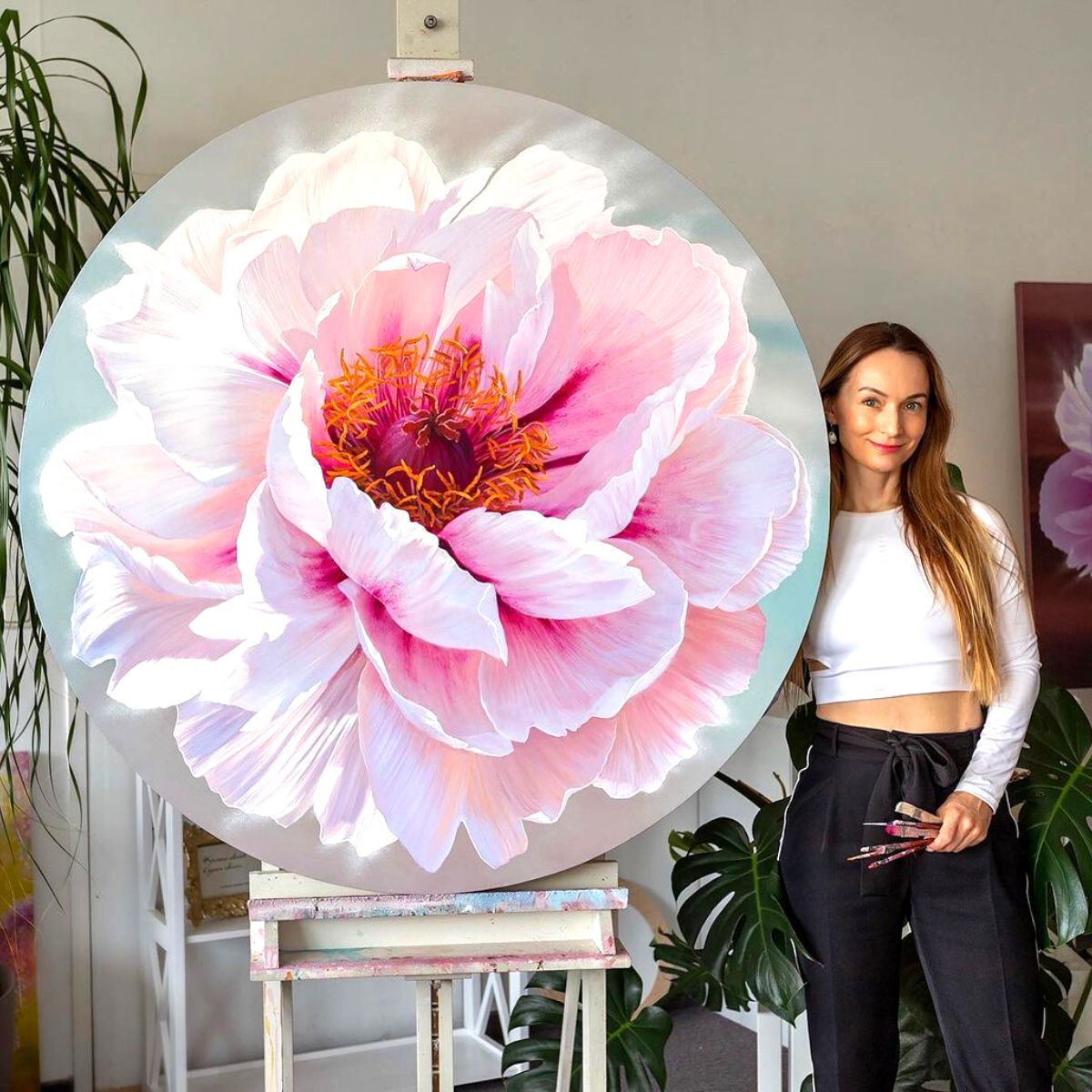 Ira Volkova with an oil peony painting