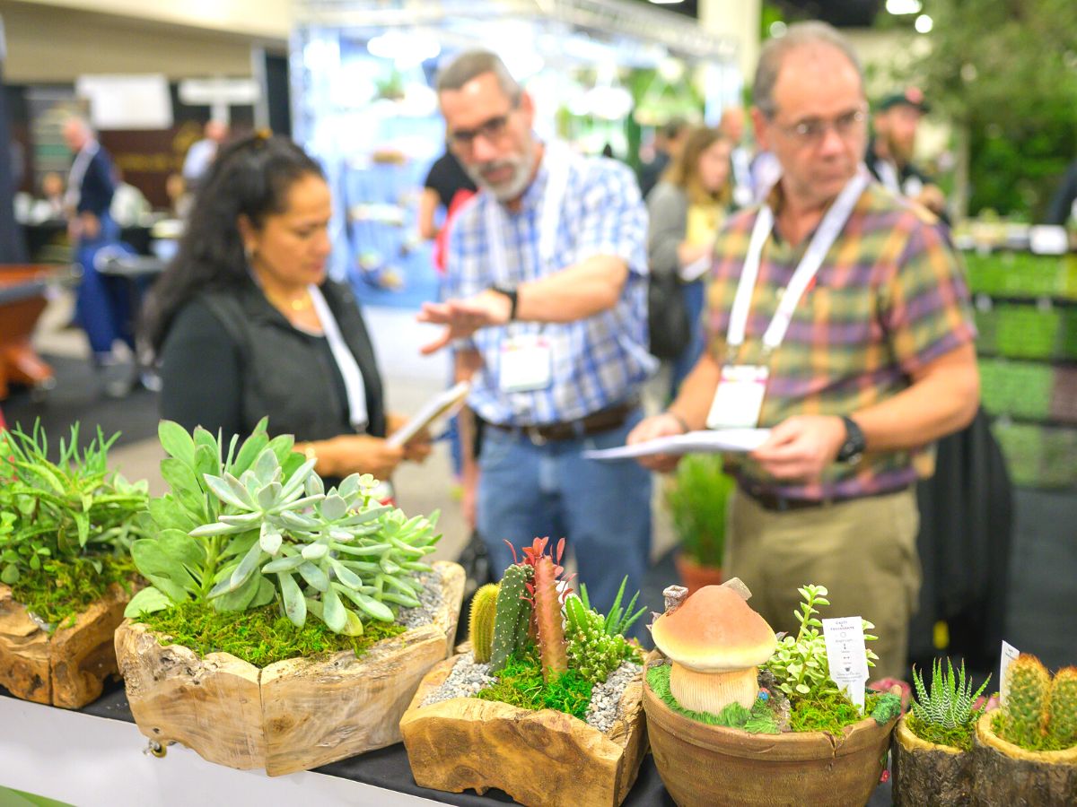 Visitors looking at tropical plant innovations and new products