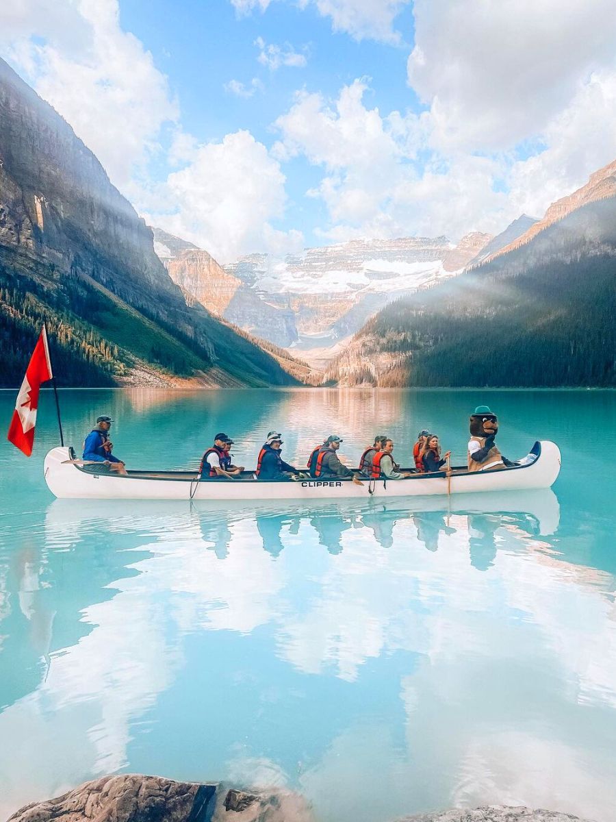 Fairmont Chateau Lake Louise with people in a boat