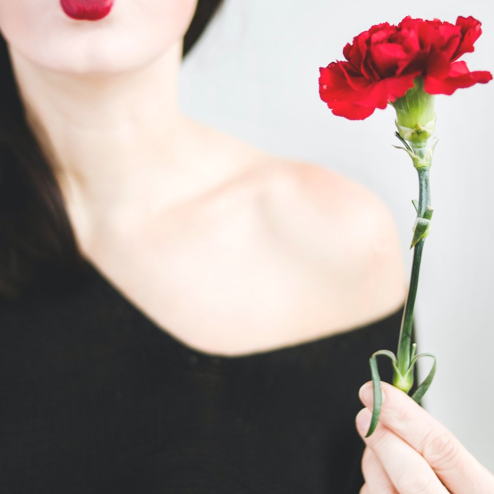 Lady with carnation flower