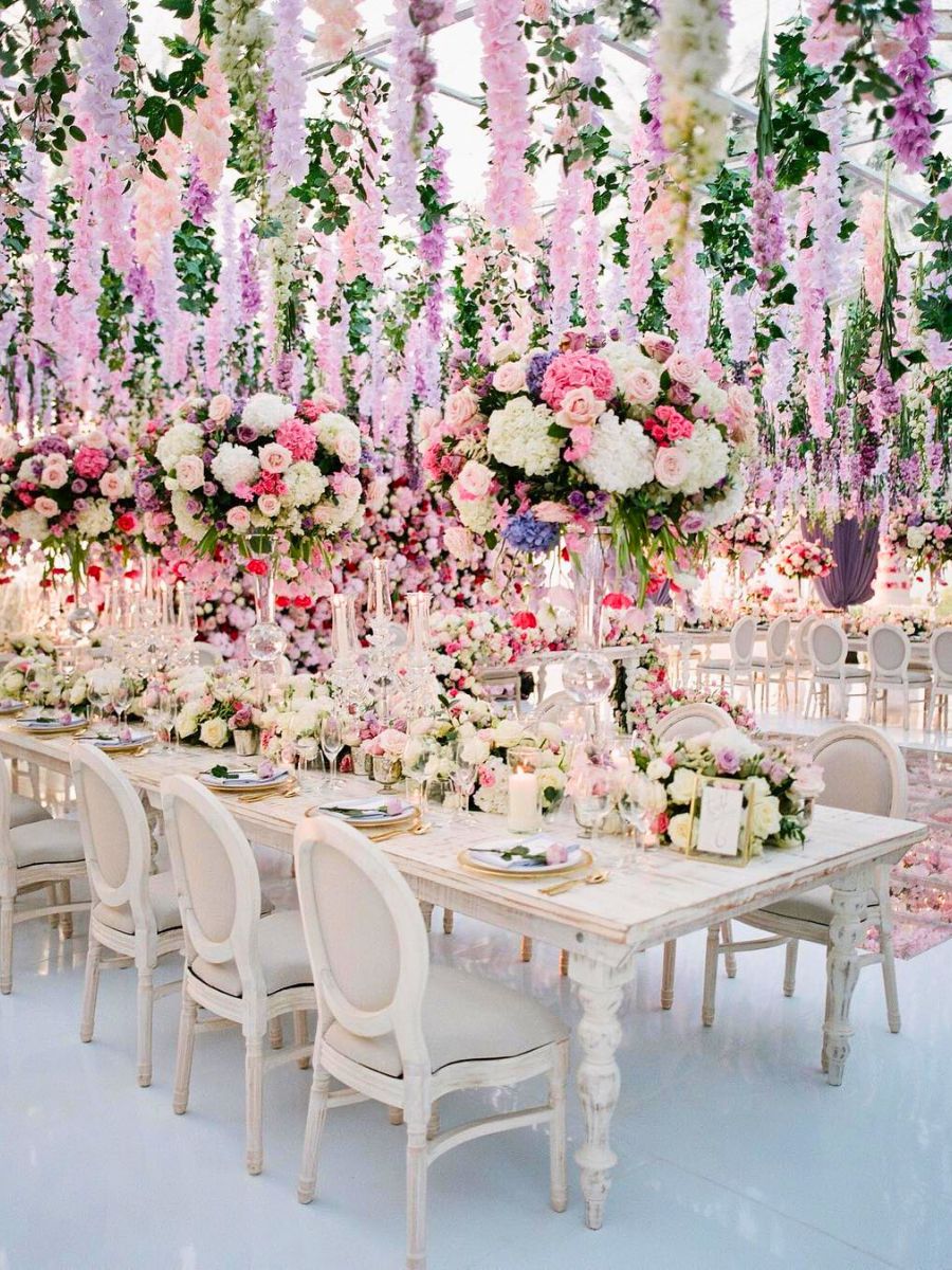A wedding reception decoration with flowers