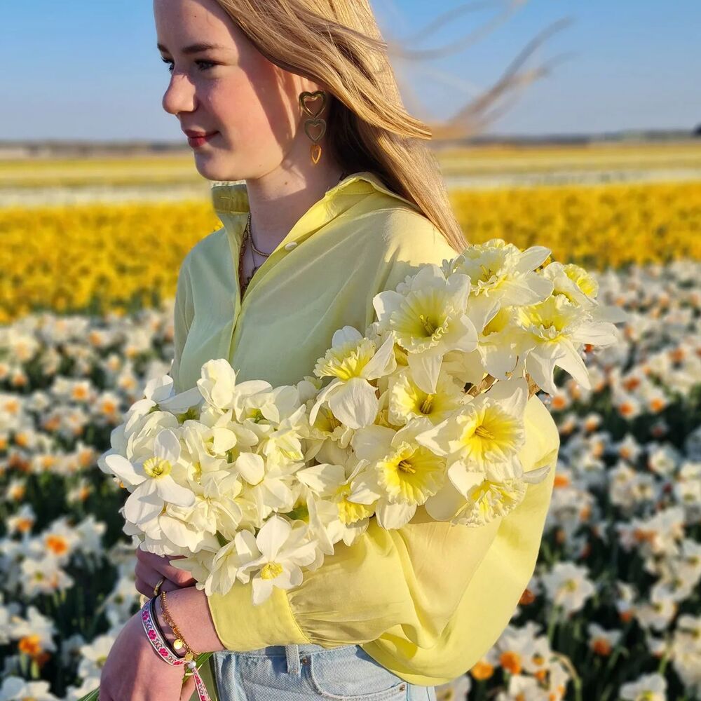 Girl at daffodil flower garden