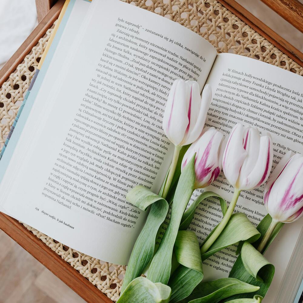Reading book with flowers