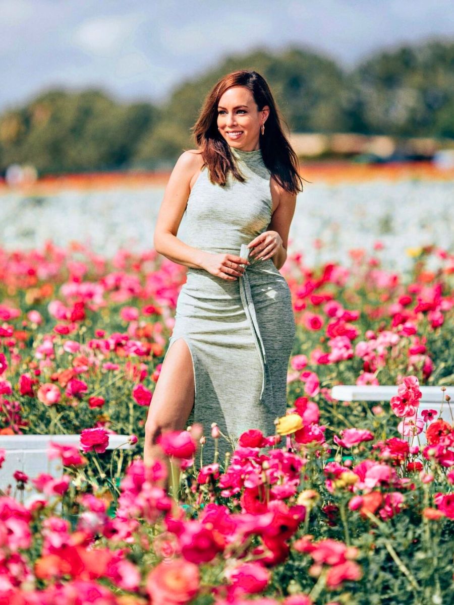 Woman surrounded by a pink flower field