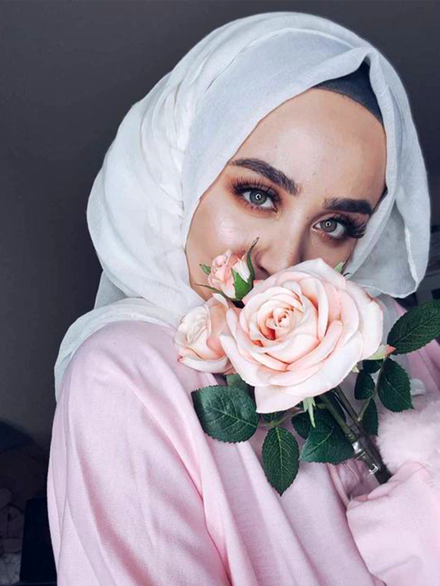 Muslim girl with pink rose