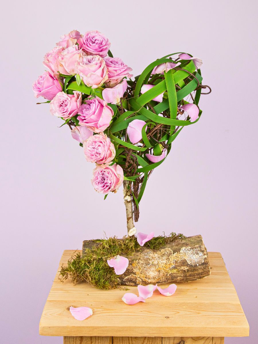 Heart shaped arrangement using Wedding Day roses