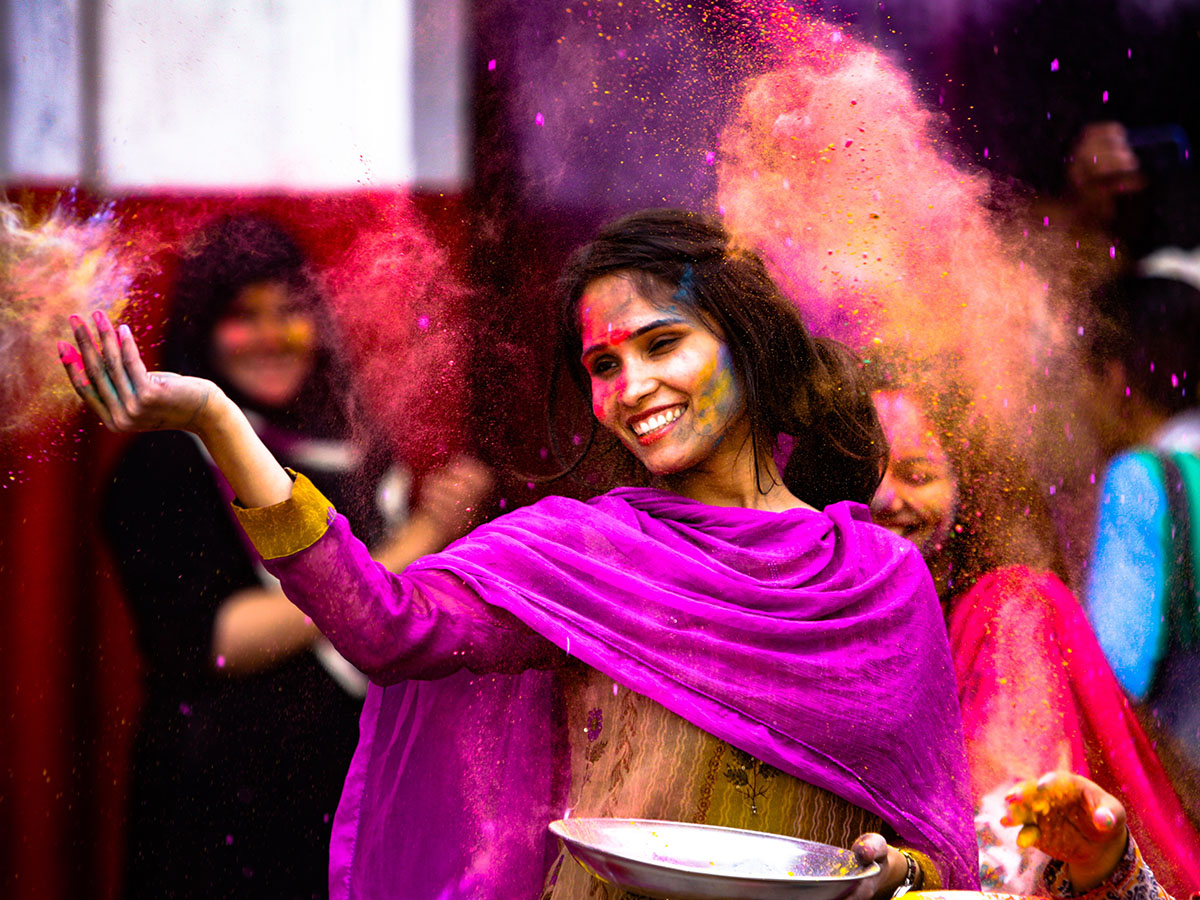 Girl in purple dress Holi Festival