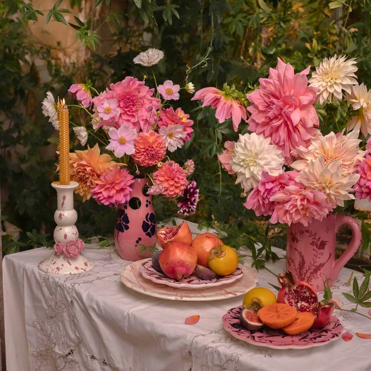 Vaiselle vases holding floral arrangements