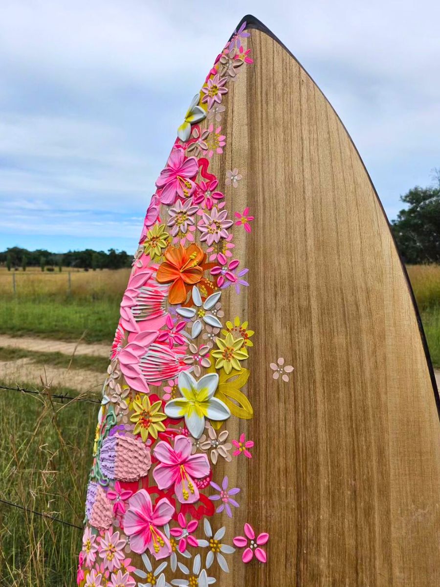 Closeup of floral art in surfboard by Alex Mason