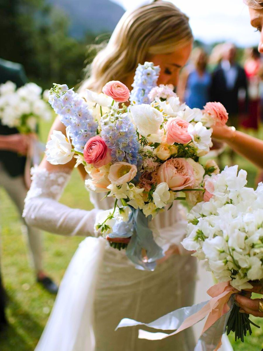A wedding bouquet with colorful and neutral flowers