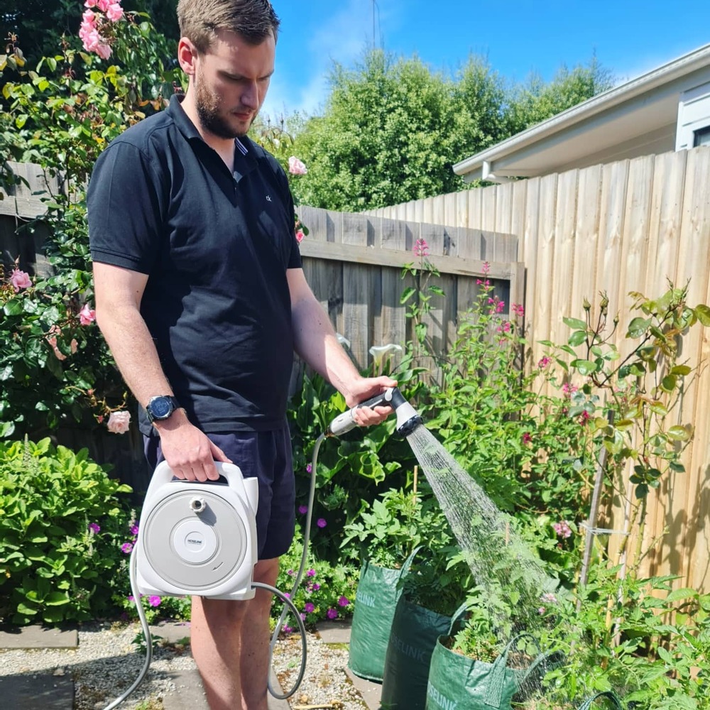 Men watering to home plants
