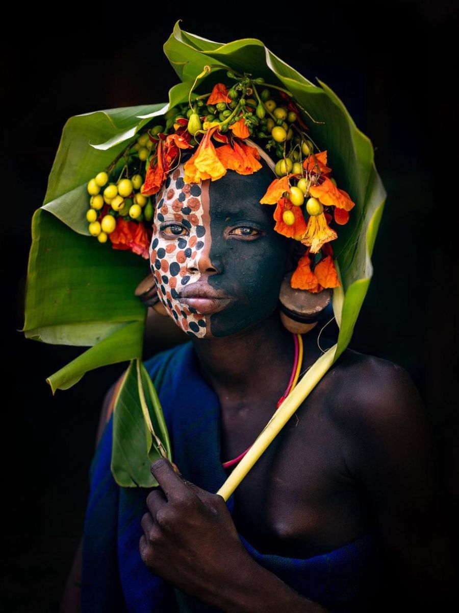 Portrait of a girl with flowers from Omo tribe