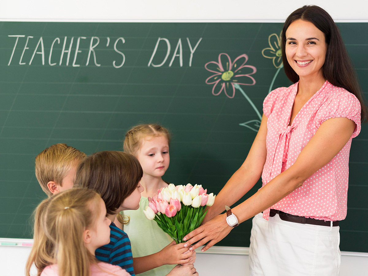 Teacher getting flowers from children