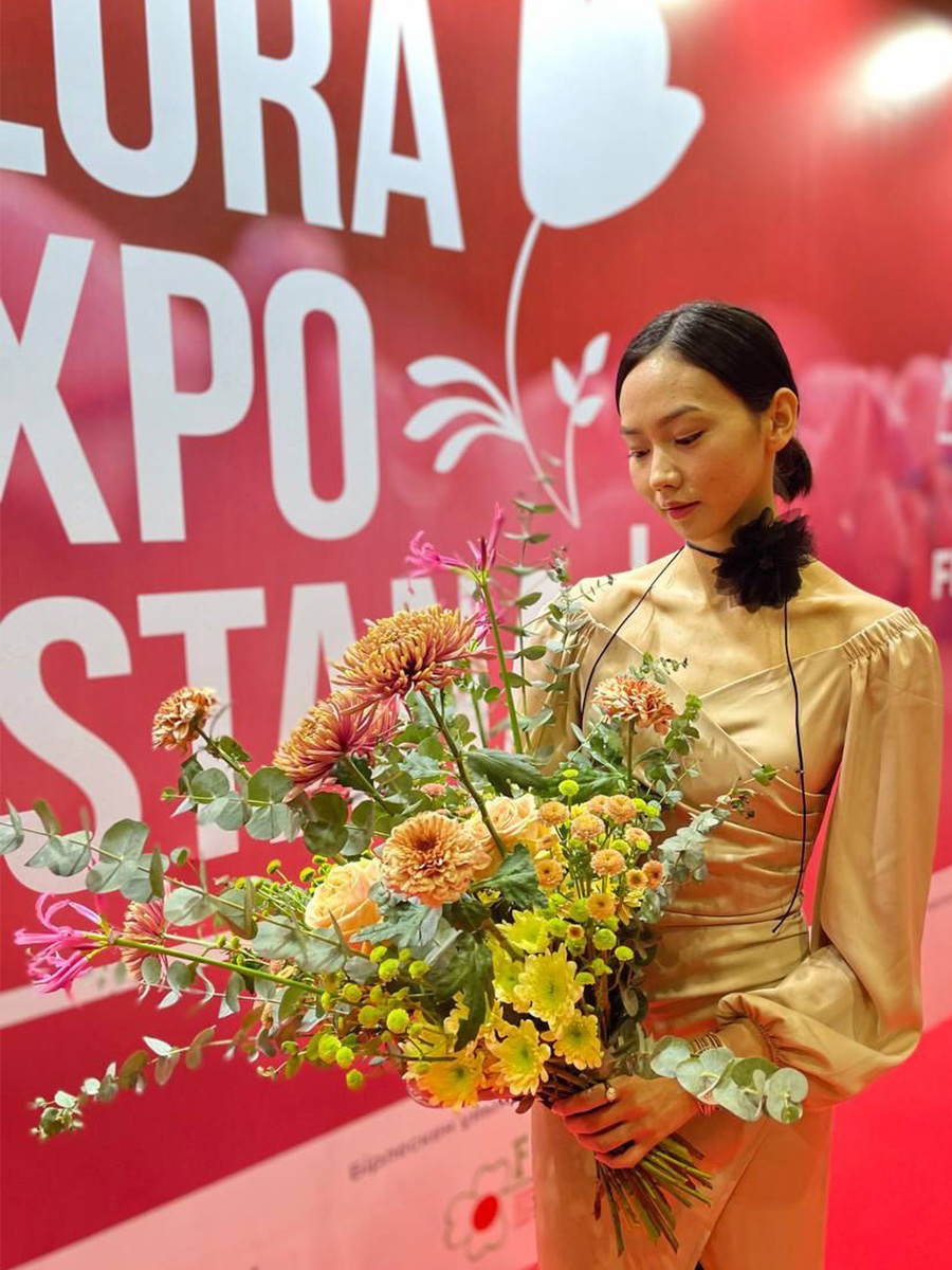 Kazakh girl with bouquet at Flora Expo Astana 2024