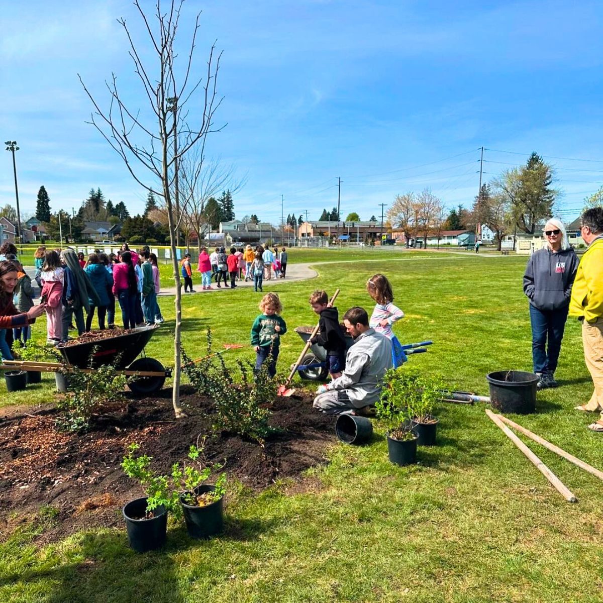 Kids planting trees on Arbor Day