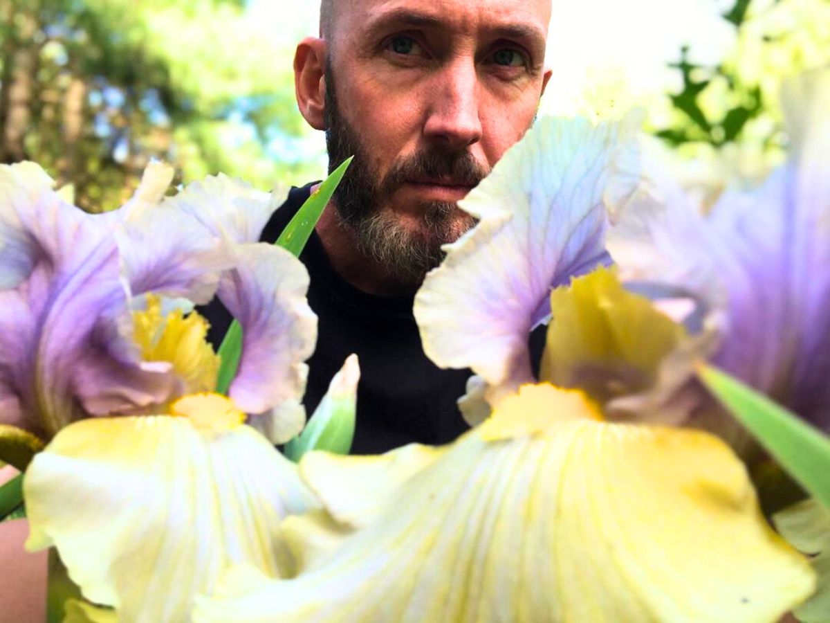 Man surrounded by Irises
