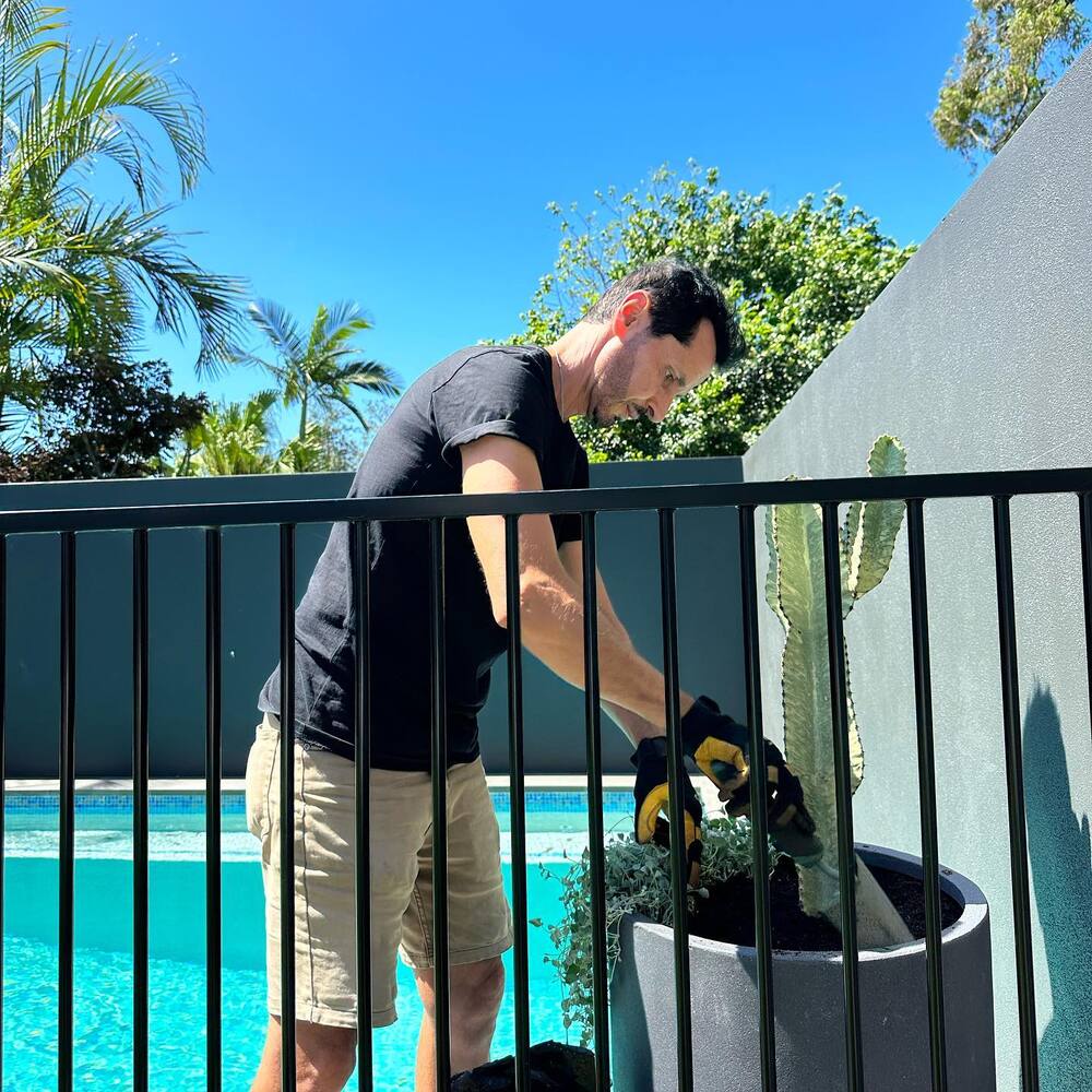 Man Potting soil to plant