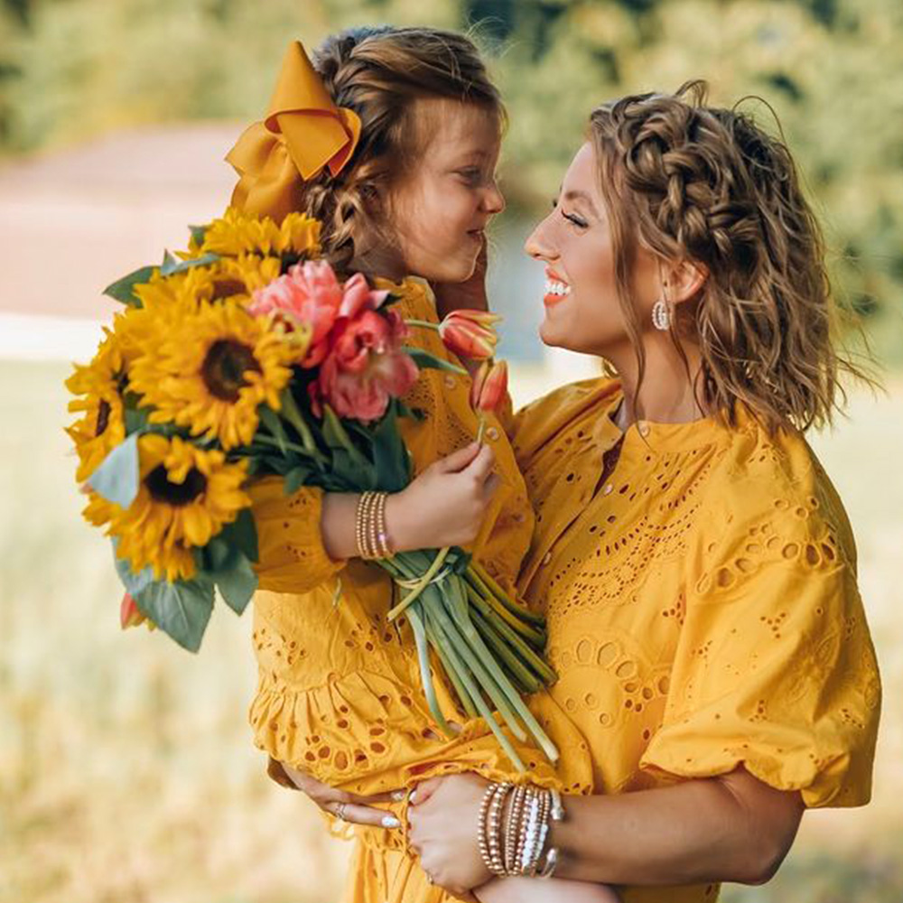 Girl with Mothers Day bouquet from somethingdelightfulblog