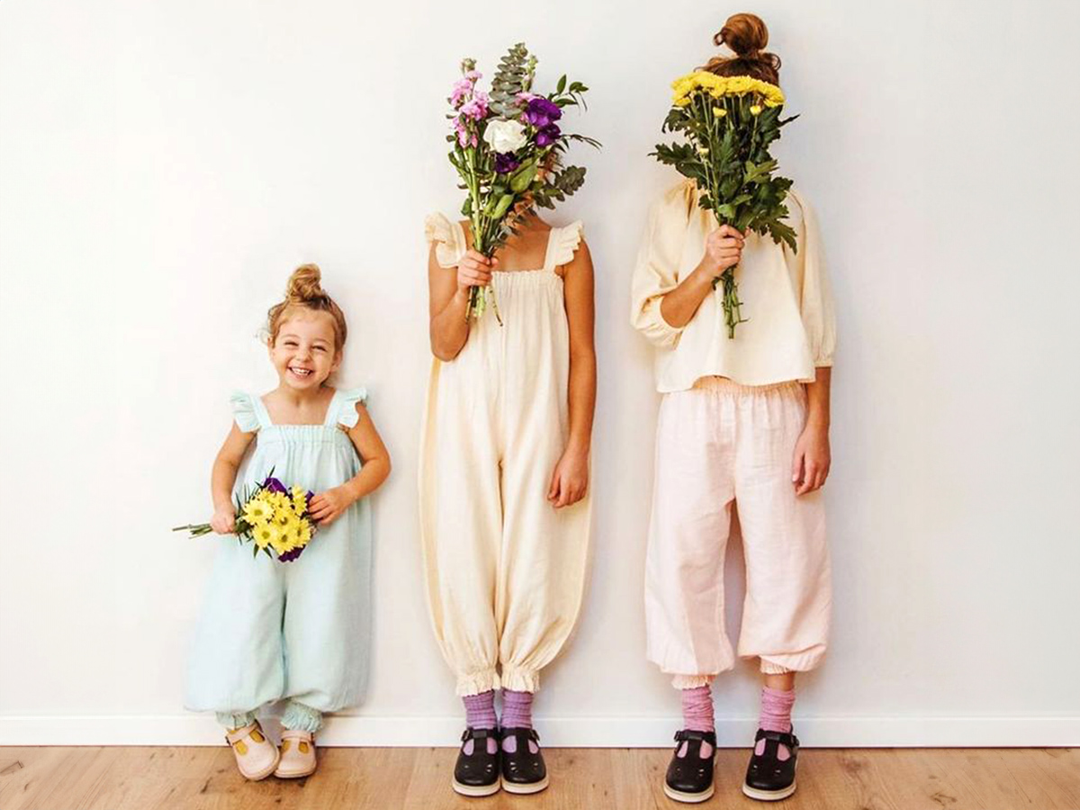 Three girls with bouquets for Mother