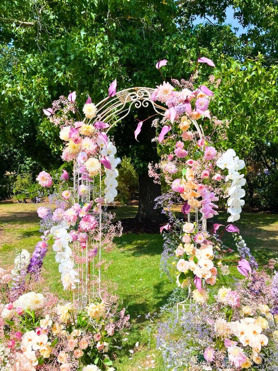 A colorful and varied flower arch for a wedding