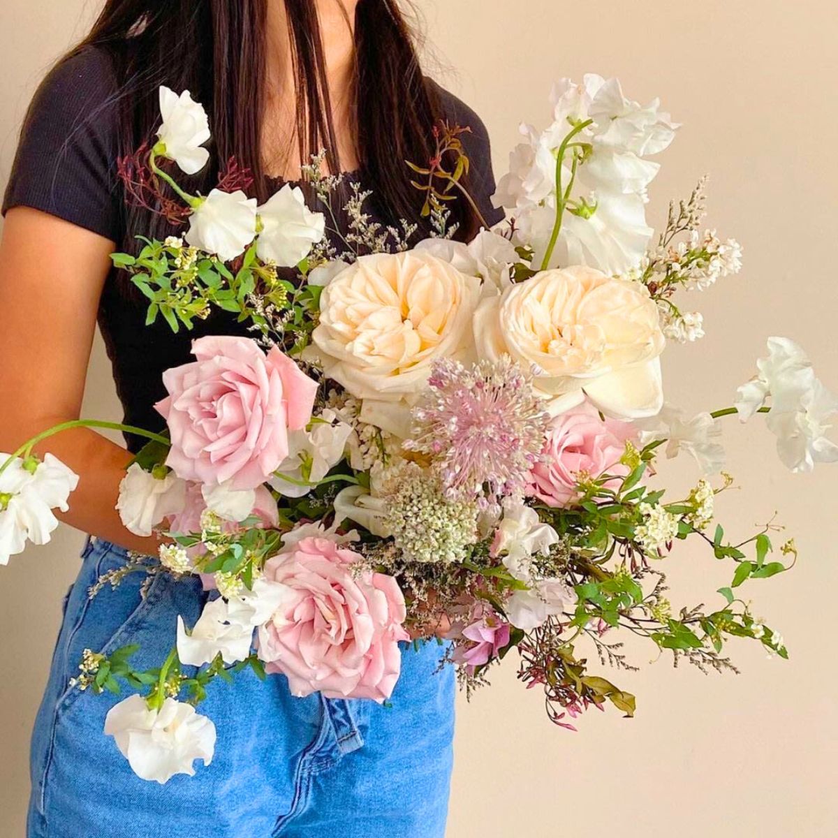 An arrangement using White O Hara roses