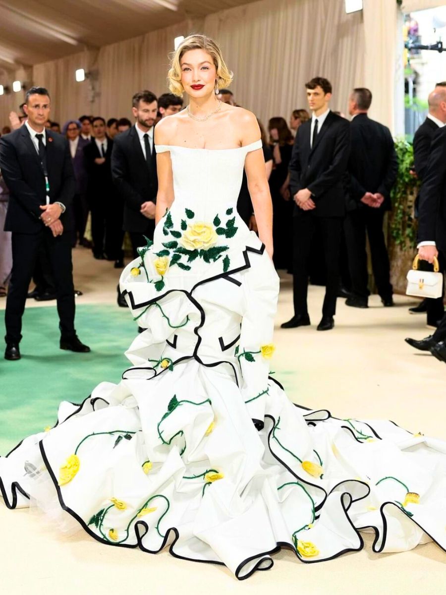 Gigi Hadid in a white dress with yellow flowres