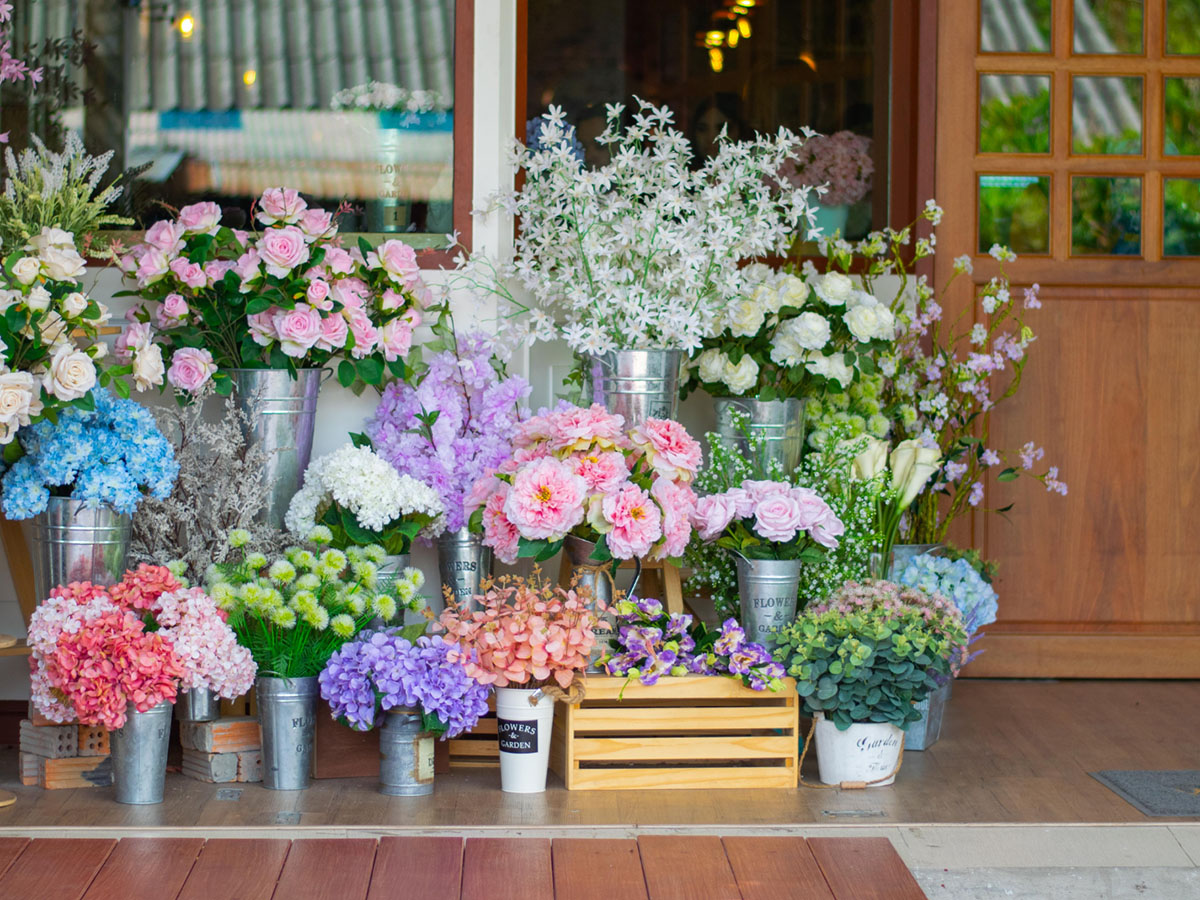 Flower shop display with tin buckets