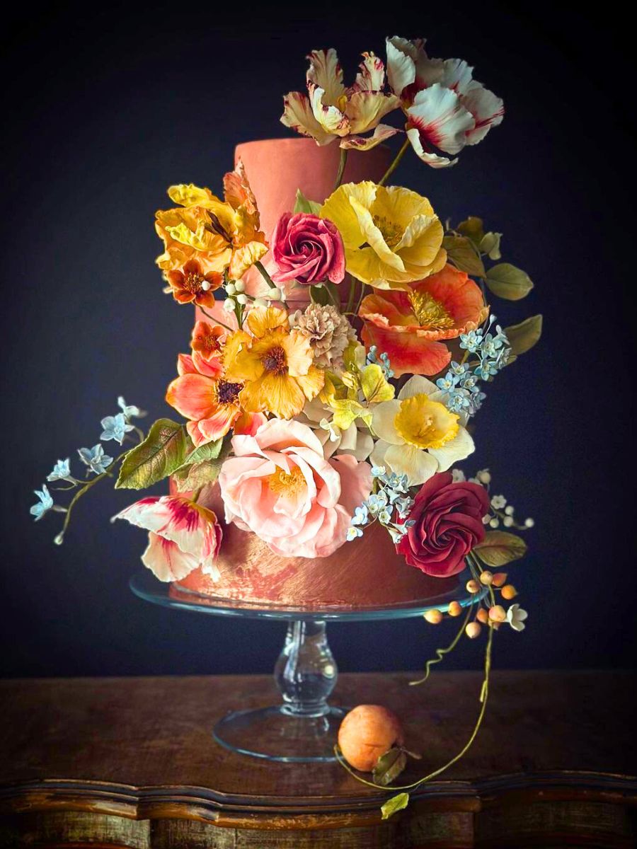 Peachy colored cake with sugar flowers