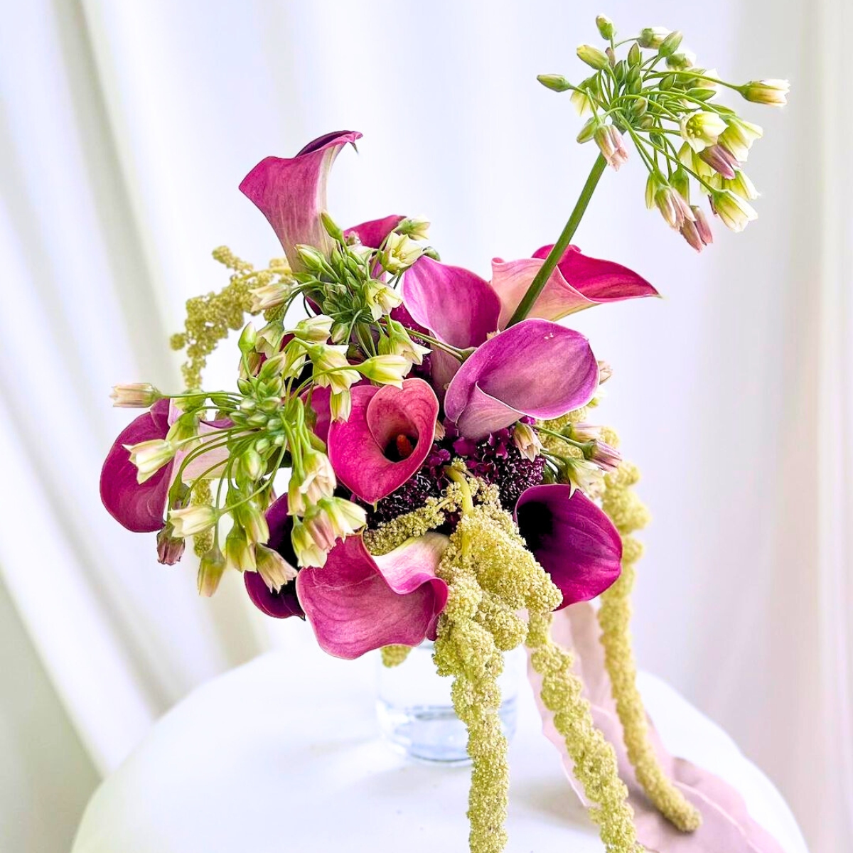 Wedding arrangement with pink toned callas