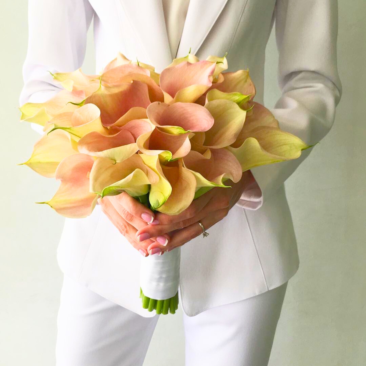 An elegant peachy calla bouquet