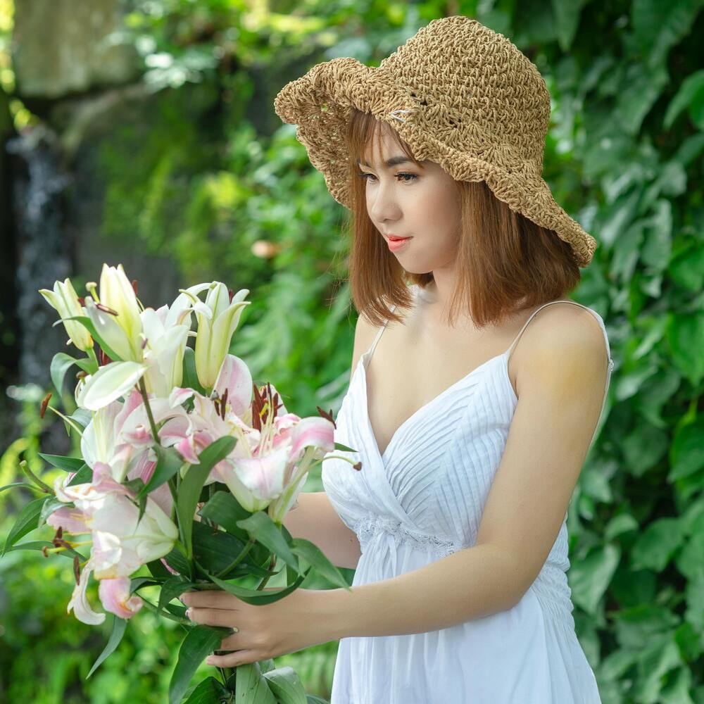 Lady collecting white flower