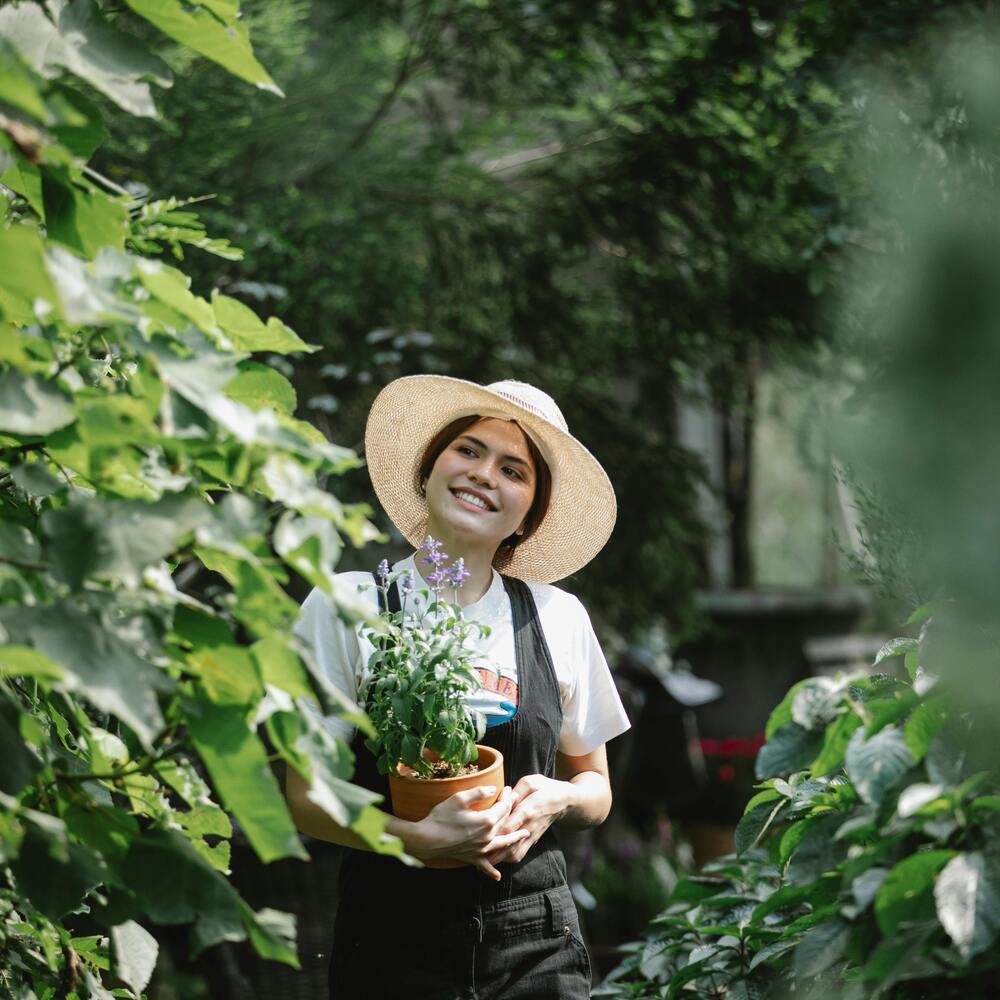Girl standing in flower garden