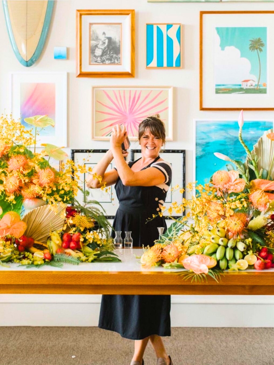 Tamara Rigney surrounded by tropical flowers