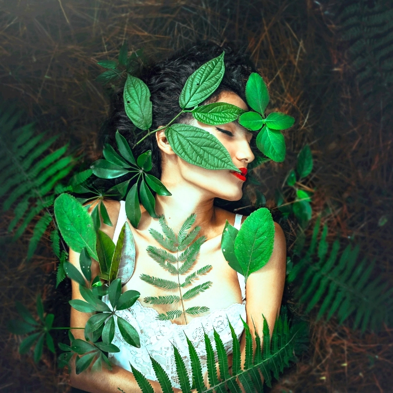 Girl with plants surrounding her