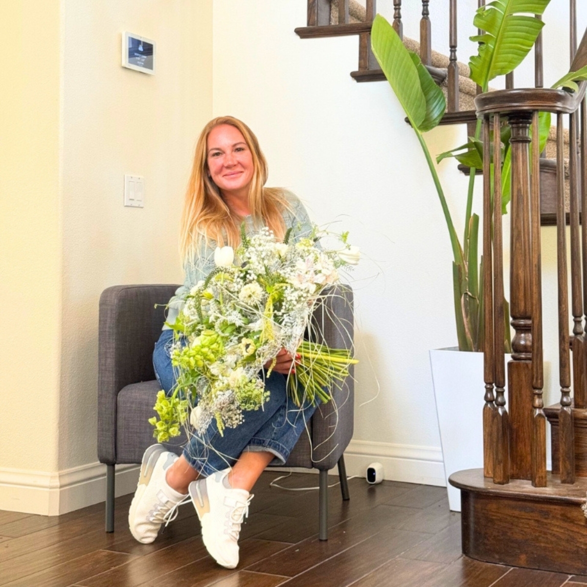 Anna with a floral arrangement