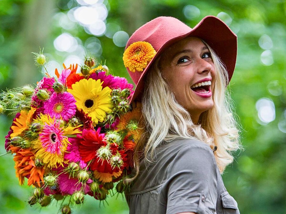 Happy girl with gerbera bouquet