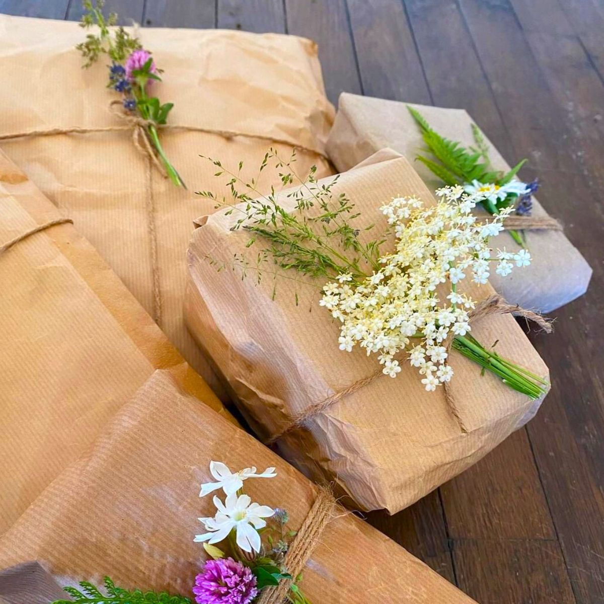 Paper wrapped presents decorated with seasonal flowers