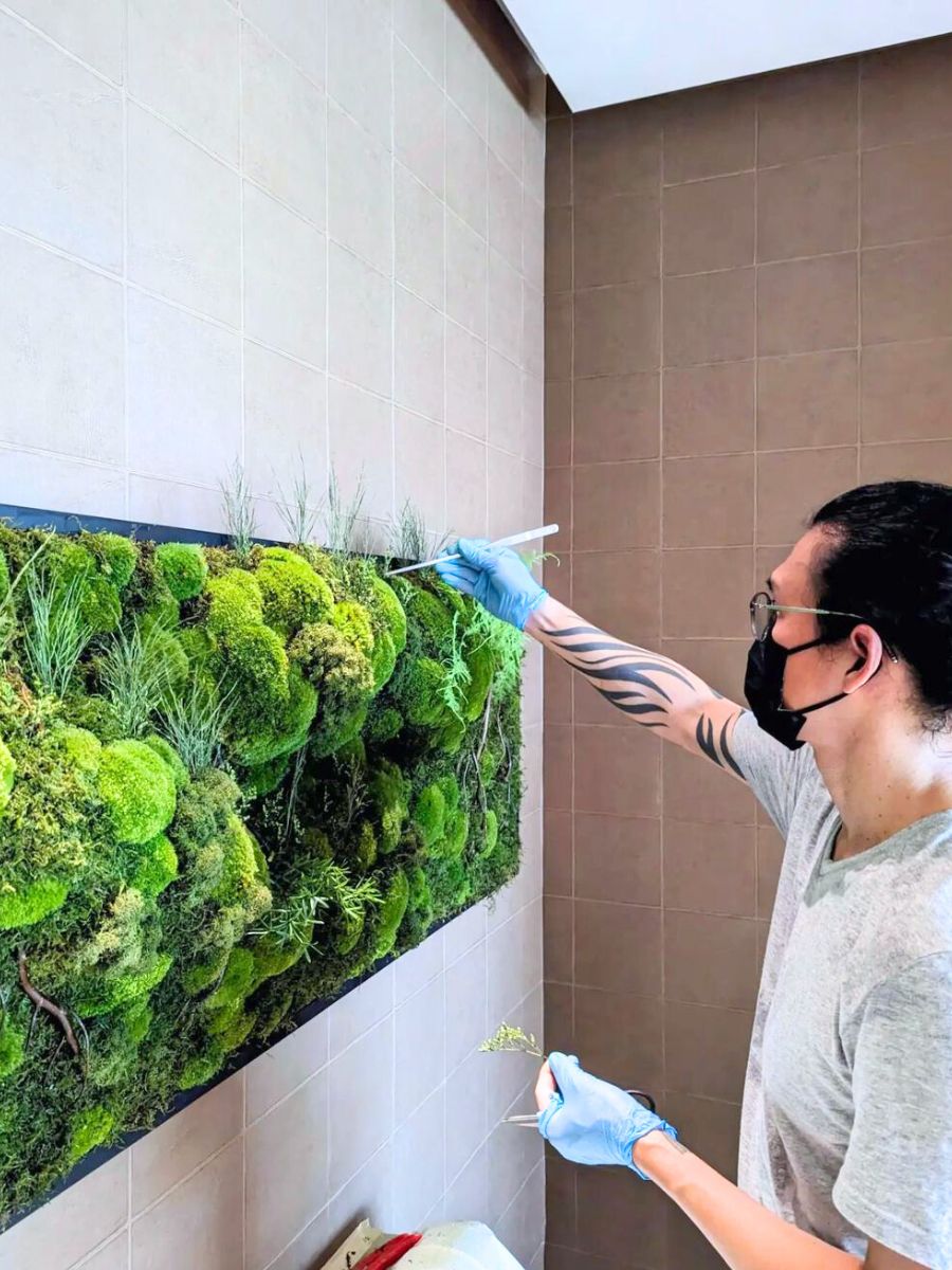 Ohsum Mossum working on moss wall