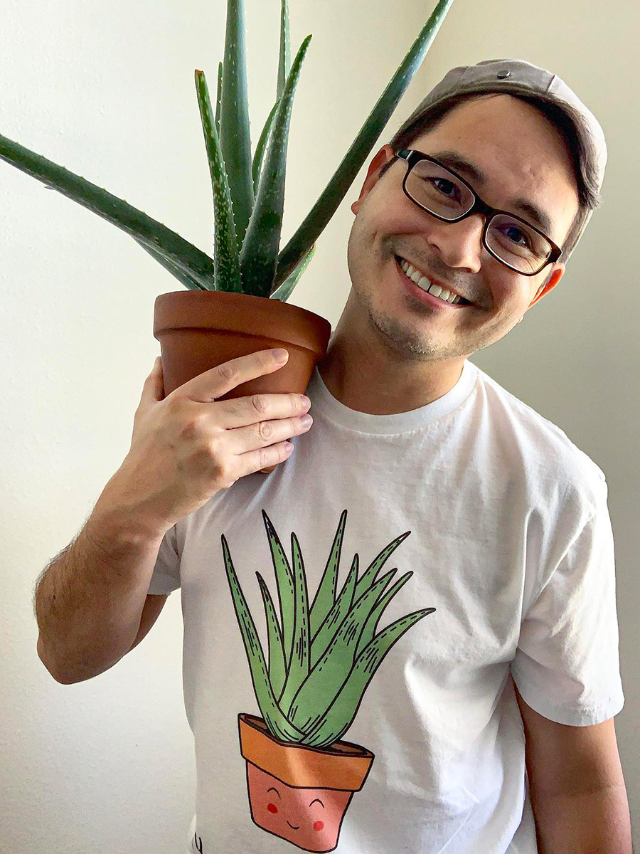Happy man with Aloe Vera plant