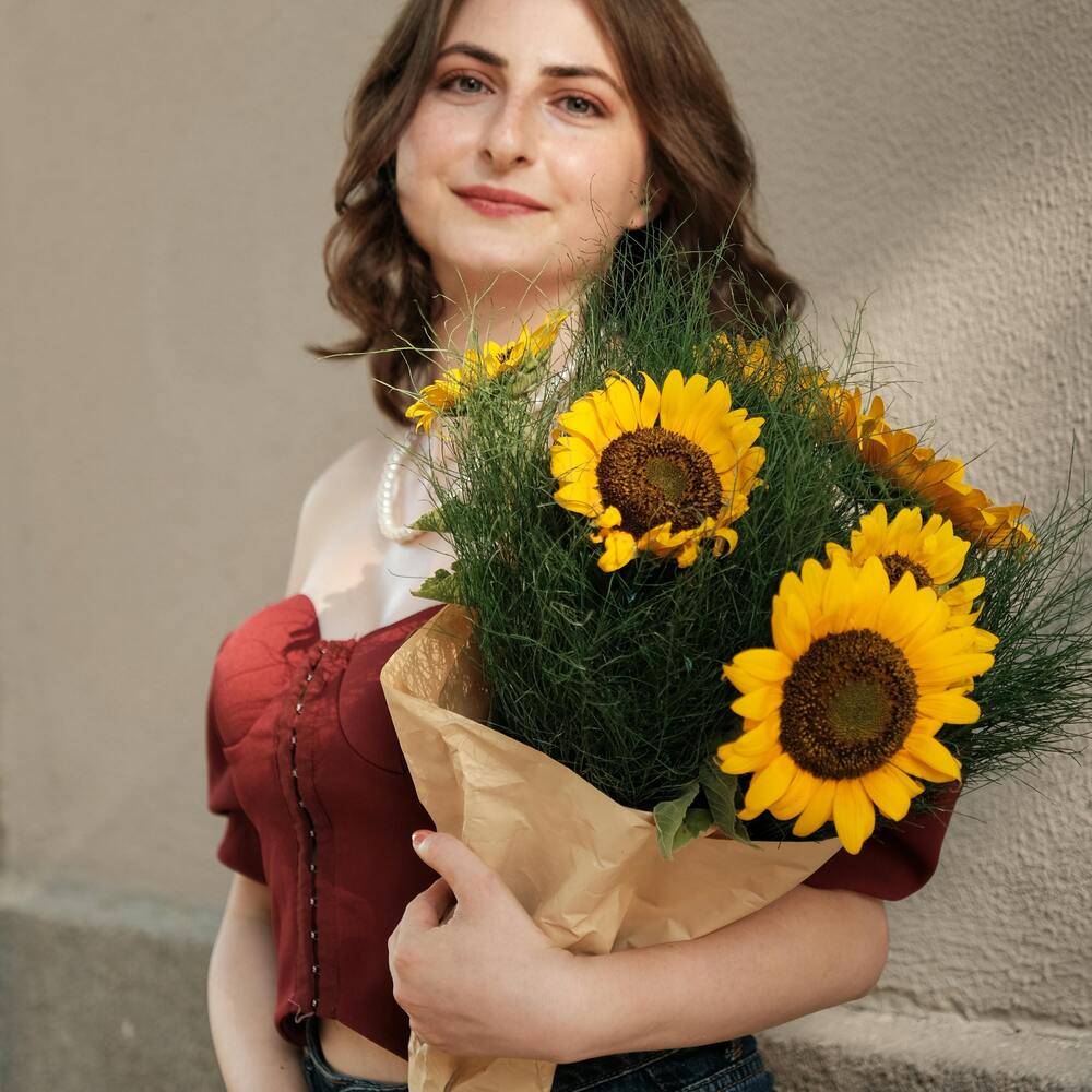 lady holding Sunflower yellow bouquet