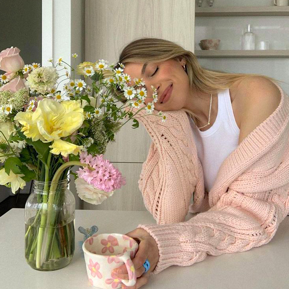 Vivien Beauty with peach sweater and a bouquet