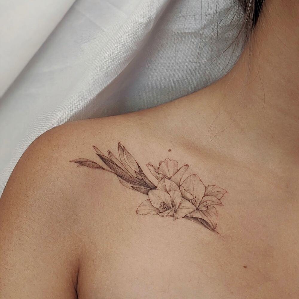 gladiolus flower tattos on shoulder 