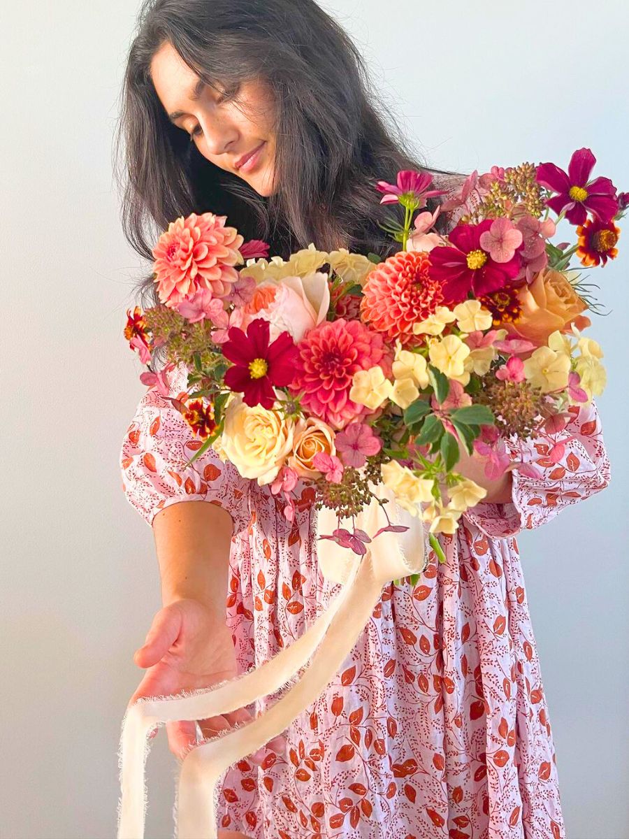 Tricia DiMarco with a floral creation