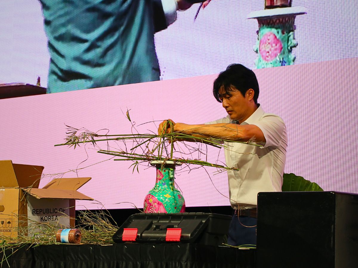 Hung Mo Joo Momo Republic of Korea working on his display during the finals of the Floral Windows to the World Championship