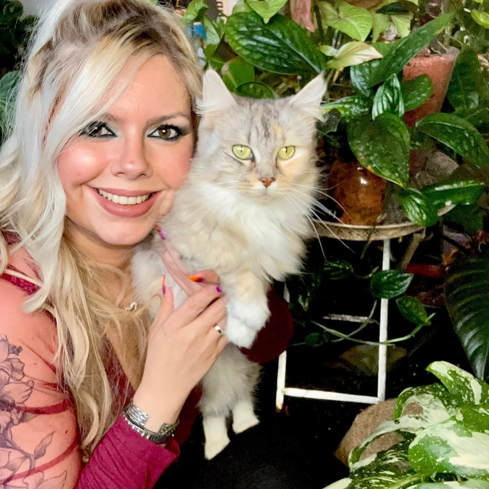 Lady with white cat at home