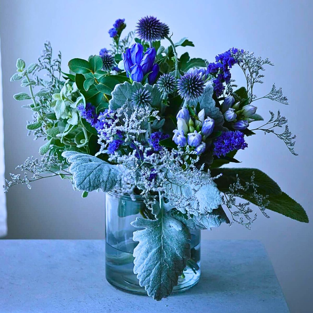 beautiful bouquet featuring blue blooms arranged in a vase