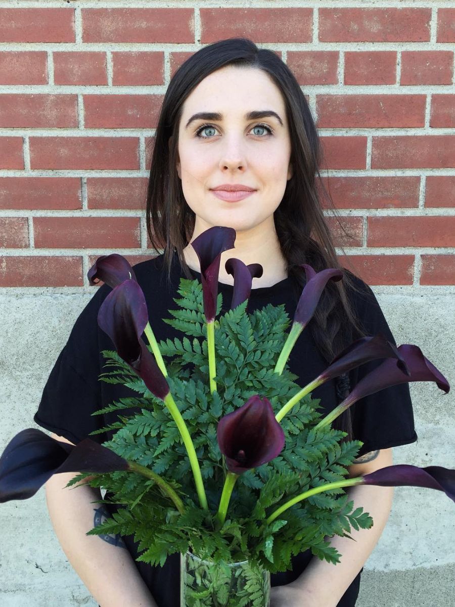 Girl with dark colored callas