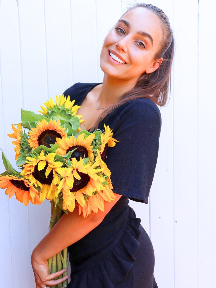 Girl with sunflower bouquet